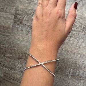 Silver rhinestone cross over bracelet